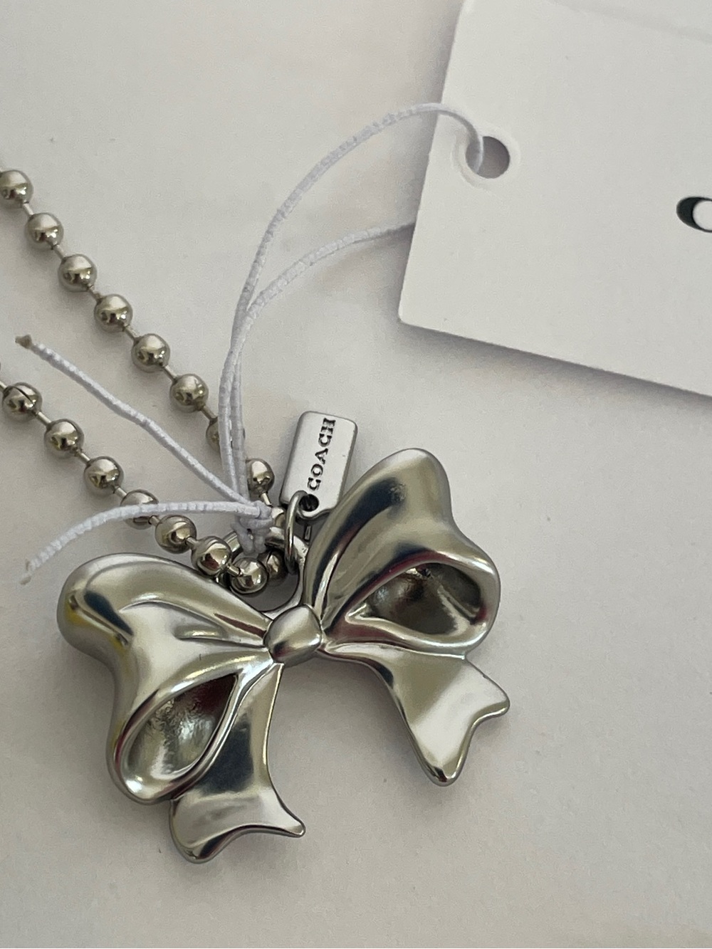 NWT Coach New York Exclusive Silver Bow Charm - Picture 4 of 4